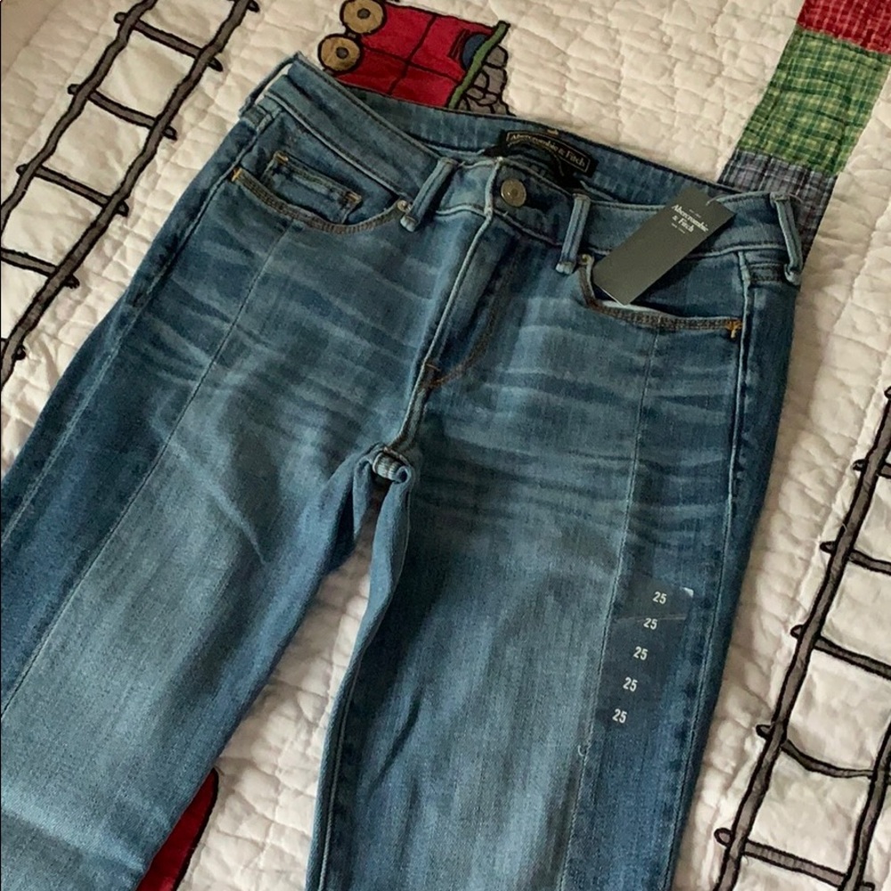 Denim skinny jeans with paneling and raw edges